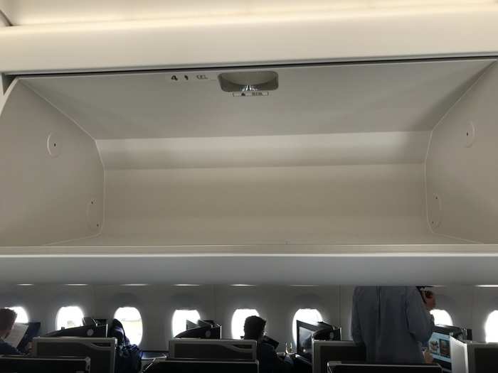 The overhead locker was huge — there was way more space than any one person could fill — and after you opened it, it lowered itself down. Very slick.