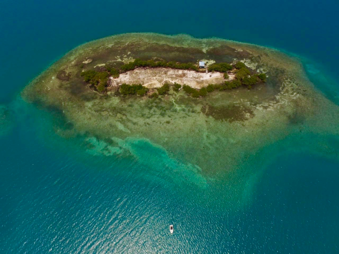 The largest and most expensive of the three available islands spans 1.5 acres and is located off the coast of Dangriga Town in southern Belize.