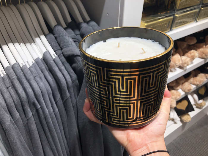 ... and giant, $115, three-wick, scented candles — the "T" pattern seen on the outside of the candle is also used in a lot of the bath goods packaging.