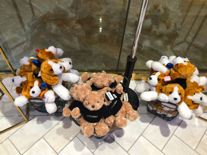 On the floor underneath the necktie display were three baskets of stuffed animals. The bears were wearing sweaters that had "Trump" written across the chest.