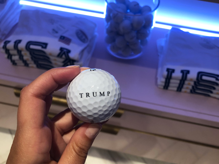 Between the shirts were jars of Trump-branded golf balls.