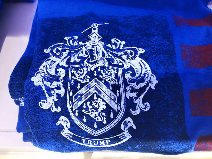 There were also shirts that featured the controversial family coat of arms — it reportedly belonged to another family and featured the Latin word for integrity where this crest reads "Trump."