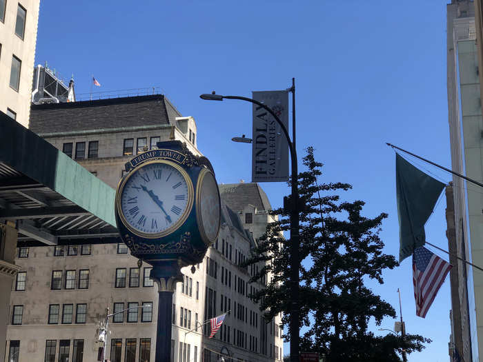 Aside from the barricades — which did take away from the magical feeling I usually get while walking this stretch of Fifth Avenue — an ornate clock and a series of flags hanging from the building brought me into the gilded mindset that this building drapes over visitors.