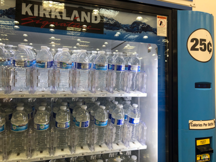 Like with the hot dogs and restaurant cards, I kept finding random deals that were so good I could barely believe it. On the way out, I found this water bottle vending machine. These 16-ounce bottles of water cost a quarter each. You