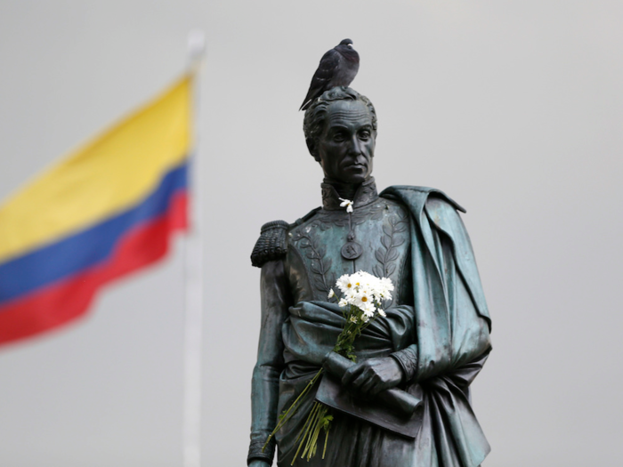 Statues and paintings also depict Simon Bolivar, the military leader who liberated Latin America from Spain, holding his sword or documents in his left hand.