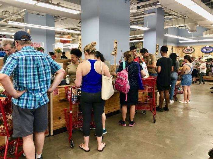 The check-out line seemed long at first glance, but it moved rather quickly. Many registers were open and each crew member had a wooden oar to let customers know they were ready to check them out.