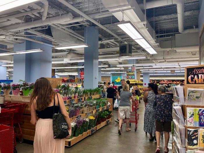  The soft tone of the blue walls and light wood finish on the shelves contributed to an overall laid-back atmosphere in the store. 