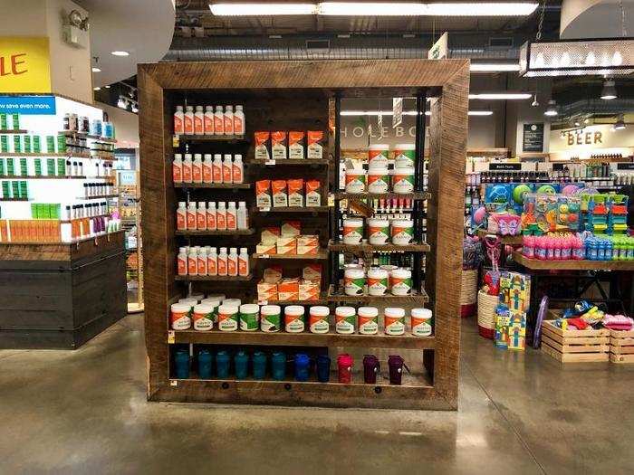 The store seemed to be going for a rustic look, as seen in these display shelves that had a dark wood finish.