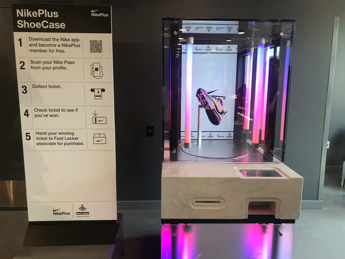 Once the customer has scanned their code, the featured shoe spins and the machine glows with purple florescent lights as it prepares to release a ticket.