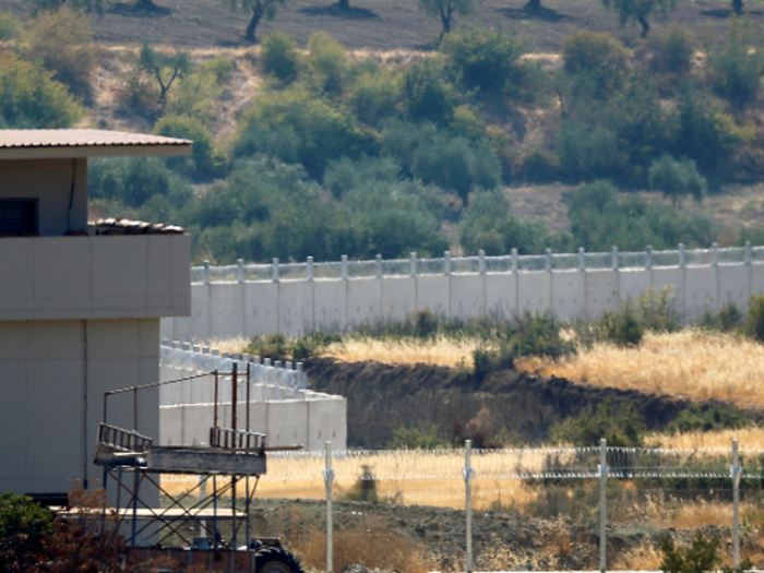 A wall between Syria and Turkey extends across 764 km of the 911km border to keep the Islamic State and the PKK at bay. It was completed in 2018.