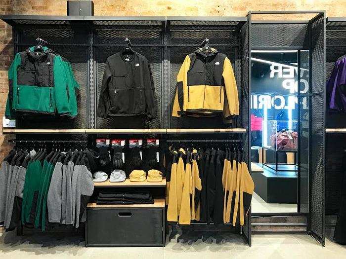 The store has essentials like the Denali fleece, as well as new features like individual booths with mirrors for shoppers to try on apparel and hooks to hang their bags and belongings.