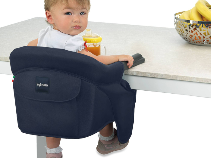 A portable high chair that attaches to tables