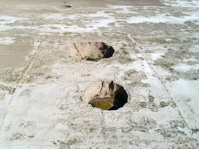 In Iran, massive holes caused by drought and water pumping emerged in the Hamadan province in 2018. Some of the sinkholes go nearly 200 feet deep. Rapid population growth, inefficient agriculture, and mismanagement of water use are driving Iran