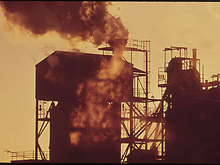 In San Francisco, industrial black smoke billows out of a stack. During the 1970s, the biggest problem for the city was ozone pollution, which mainly comes from cars, industrial plants, power plants, and refineries.