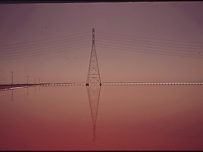 In San Francisco Bay, the Leslie salt ponds gleam at sunset. The ponds were built to extract salt from the bay water. In 2019, the EPA ruled the land, owned by Cargill Salt, was not bound by the Clean Water Act. The photographer behind this photo said the "water stinks."