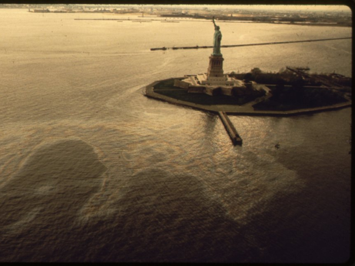 Seen here is the Statute of Liberty surrounded by oil. It was the result of one of 300 oil spills in the first six months of 1973. Between April and June of that year, 487,000 gallons of oil were dispersed in the New York Harbor and its tributaries.