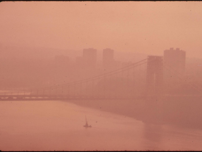 Though it might not be clear, this is the George Washington Bridge going over the Hudson River, covered in thick smog. In 1965, a study by New York City Council found breathing New York