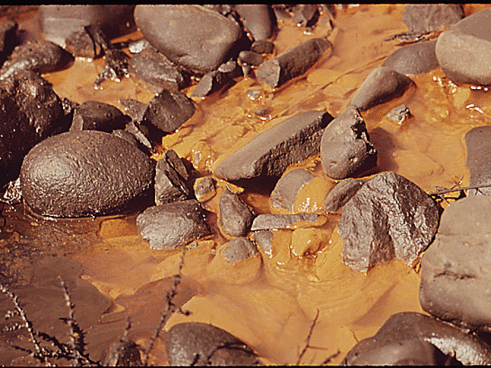 In Denver, murky light brown sewage is discharged by the Metro Sewage Treatment Plant into the South Platte River.