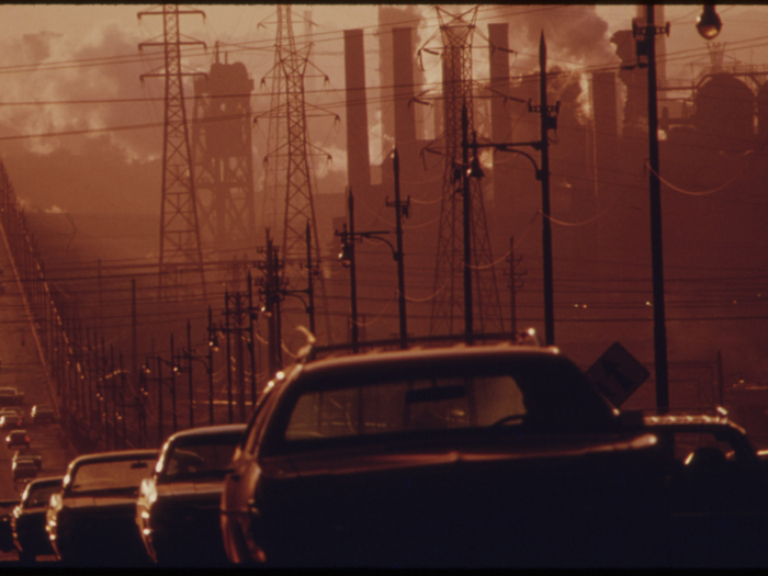 In Cleveland, in 1973, billowing smoke casts a gloom over the Clark Avenue bridge. Because it was an industrial city, the pollution was severe.