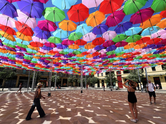 In southern France, an art installation called “Umbrella Sky Project” provides visitors with a photo opportunity and lots of cover from the sun.