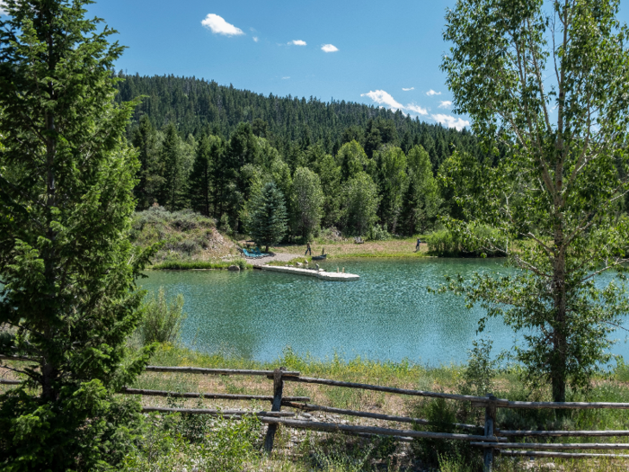 In addition to activities like horseback riding, cattle penning, rafting, fishing, and hiking, guests can hang out and go swimming in the ranch