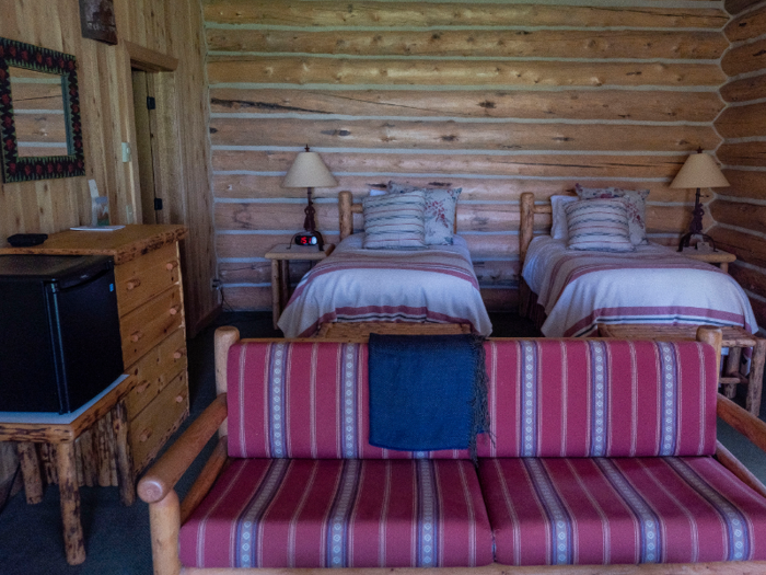 The lodge has two bedrooms, both of which come with a sofa, coffee table, and a dresser.