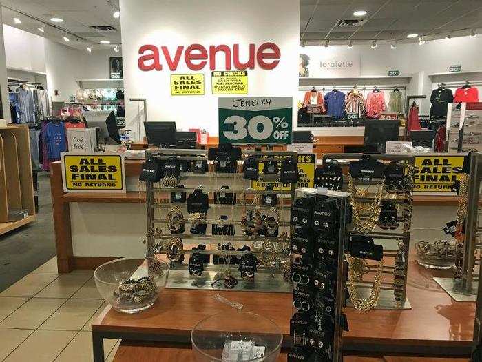 As we walked toward the back of the store, we saw tables piled with discounted accessories. Around the register we spotted several signs notifying shoppers that all sales would be final.