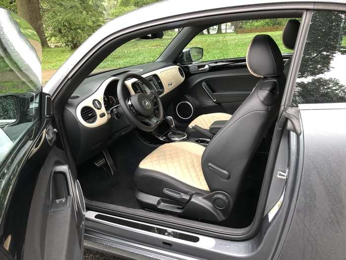 The two-tone interior was smashing, and while the back seat is as hard to access as it is in any two-door, its fairly roomy.