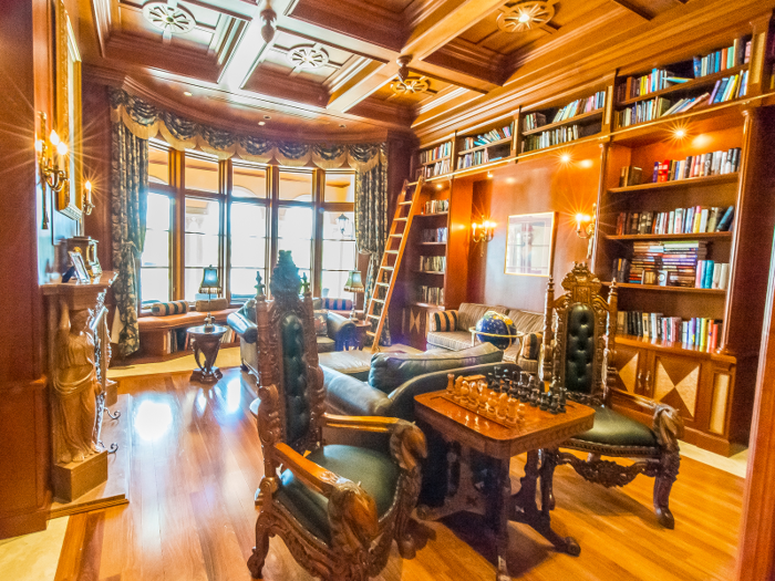 The library features a built-in closet humidor for storing cigars.