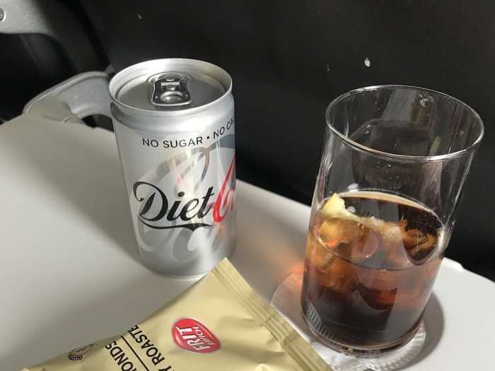 Back in Club Europe, cabin crew started serving refreshments as soon as the seatbelt sign turned off. I opted for a Diet Coke, which was served in a real glass. Handed out in packets, the nuts didn