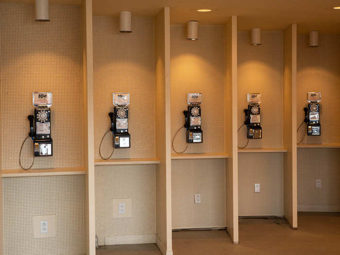 The hotel is full of throwbacks and retro touches, like a row of payphones that charge a dime for each call (you don