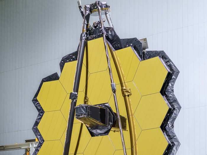 The James Webb Space Telescope, which has a massive, 18-panel mirror, will scan the universe for life-hosting planets and attempt to look back in time to photograph the Big Bang.