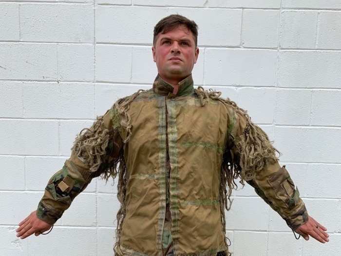 To design a ghillie suit for a mission, Army snipers "start with a base layer of artificial camouflage," Smith said, explaining that this allows them to "be a little more expedient in the field" because "it gives us a base we can change from a little bit more rapidly."