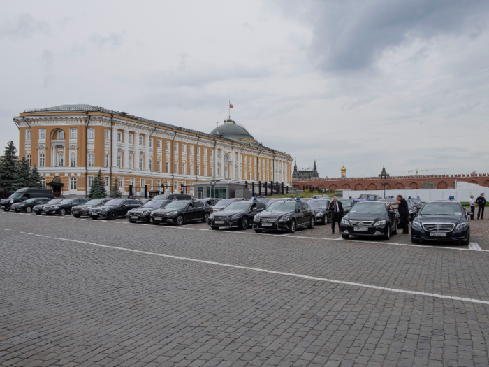 Diagonal from the gardens is the Kremlin Senate, where a fleet of black government cars with blue lights on the roof were parked.