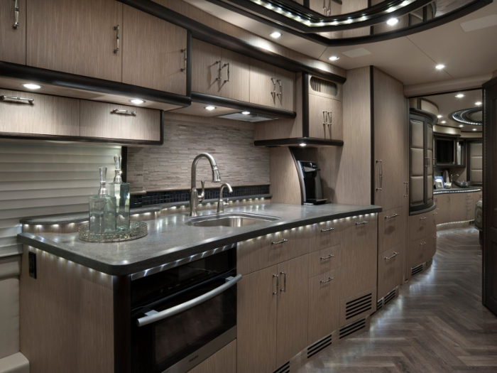 Canada-based manufacturer Prevost makes swanky RVs with luxe kitchens, slide-out all-around windows, and expansive floor space.