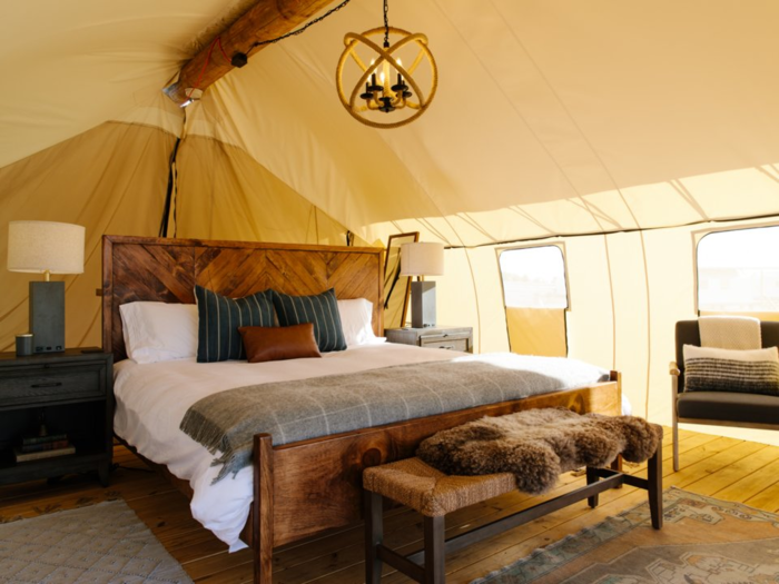 In the luxurious Summit Tents, guests sleep on 1,500-thread count sheets with a down comforter and a designer-curated blanket.