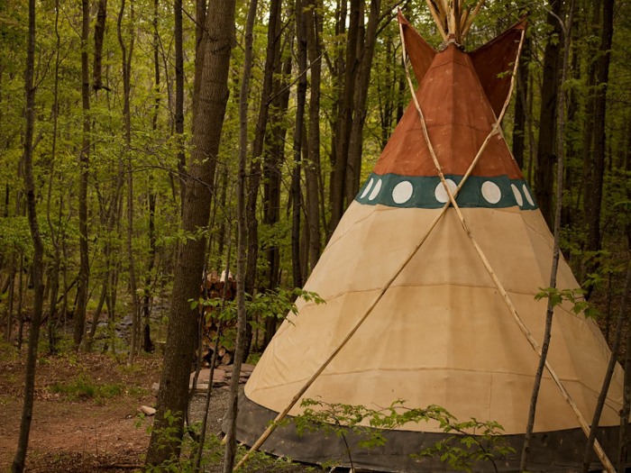 In upstate New York, travelers can stay in a luxurious, 18-foot-tall tepee that sits in the woods on a 10-acre property at Bellfire Farm.