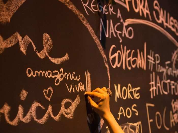 "Amazônia viva!" a woman wrote on the wall.