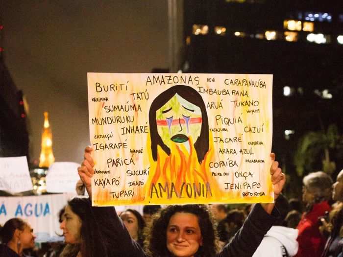 This woman proudly held up a a handmade poster, full of the names of animals and trees from the rainforest.