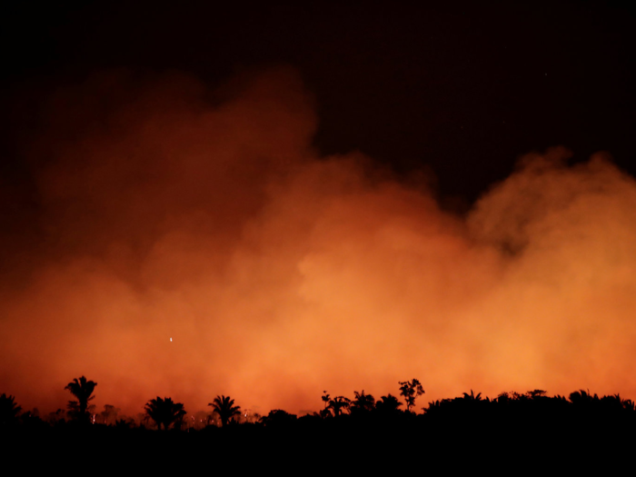 On August 17, 2019, glowing smoke in Humaitaa, Brazil, looked ominous at night. According to Reuters, the sky never goes dark while the Amazon burns.