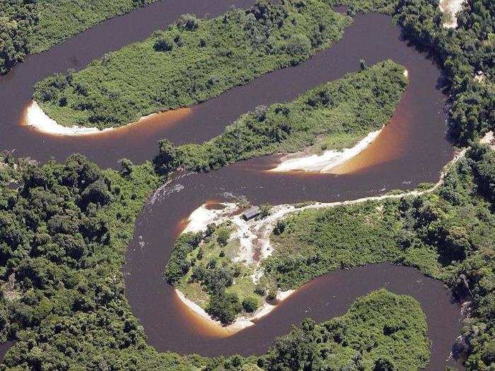 A river winds its way through untouched rainforest in 2005. The Amazon is home to 4,100 miles of rivers.