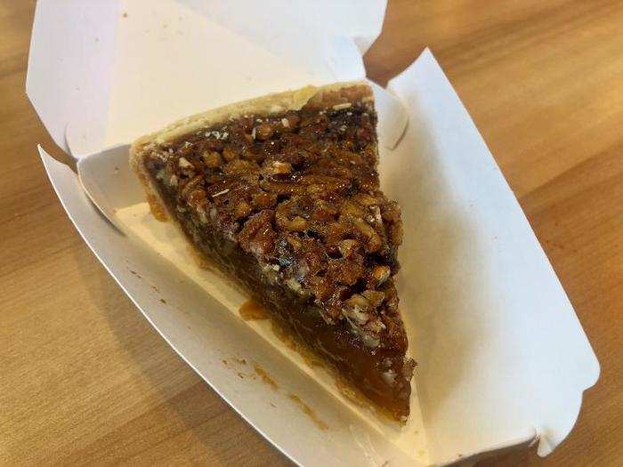 Reminiscent of a Burger King dessert, this pie is shaped like an old fashioned triangle of pie. It looks promising, with a thick filling and generous layer of pecans on top. But the single biggest sensation you get from this pie is “cold.”