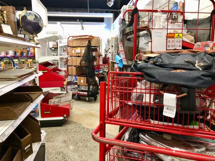 Though there were some sections with folders and lunch boxes, a lot of this area was in complete disarray. Items were being loaded onto shelves in huge quantities.