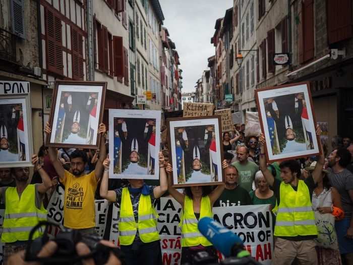  As the meetings went on, French protesters took to nearby streets to slam Macron and demand more action on the climate emergency. 