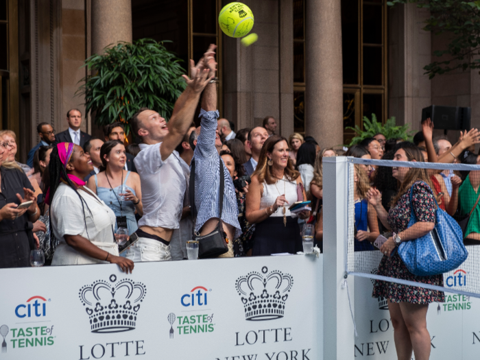 A couple of the players tossed tennis balls to lucky onlookers in the crowd.