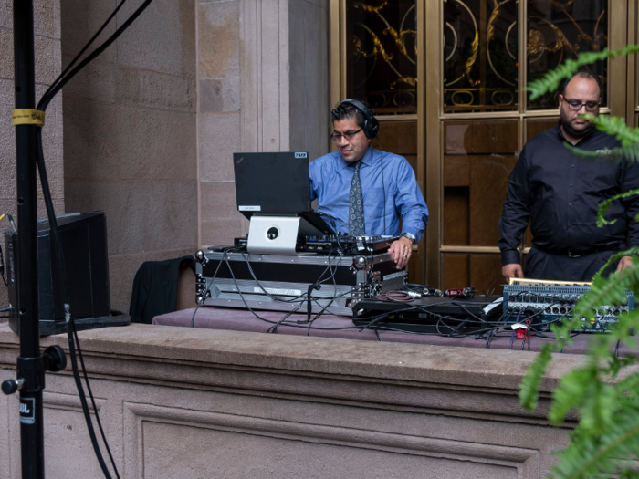 A DJ was set up in one corner of the courtyard.