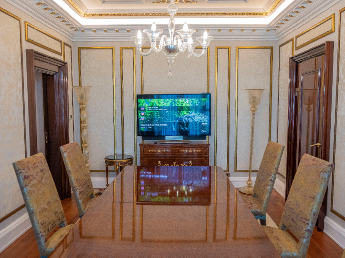 Through the kitchen, I found a dining room with a large table and six chairs, although at least four more chairs could be comfortably added.