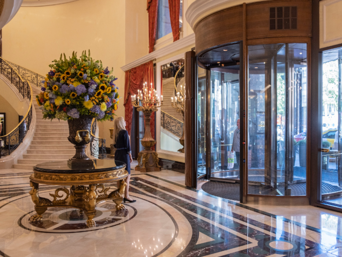 In the lobby, I was met with towering flower bouquets, elegant staircases, and gleaming marble surfaces.