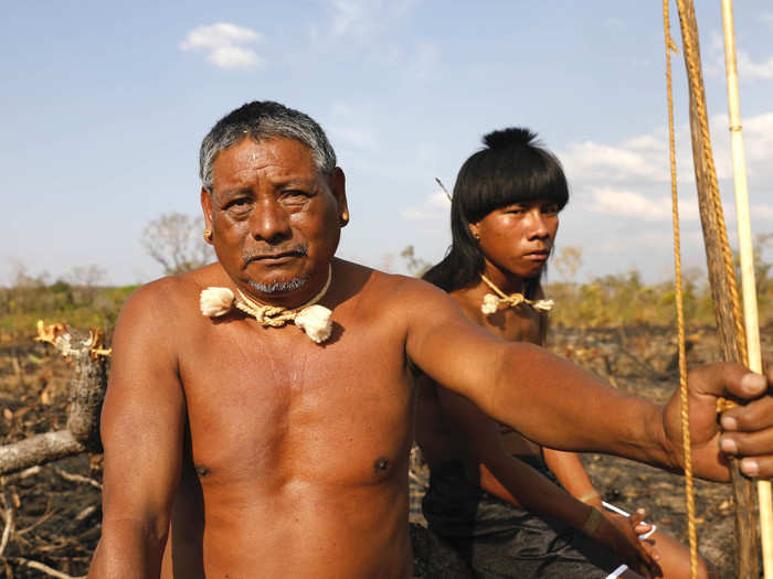 In front sits Chief Hector, 53. They are part of the Xavante tribe. In total, there are about 20,000 Xavante people across Brazil. They live in a tribe of around 100.