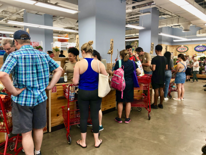 There was an employee stationed at the front of the line to keep things moving smoothly. Each cashier also had a wooden oar and a personal bell to let customers know they were ready to assist the next person in line.